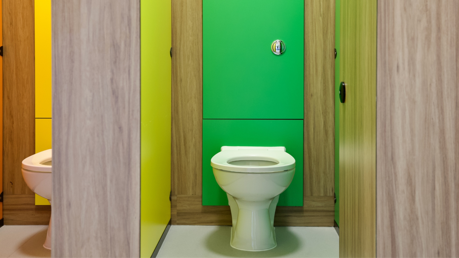 green individual toilet cubicle